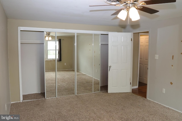 unfurnished bedroom with ceiling fan, carpet floors, and visible vents