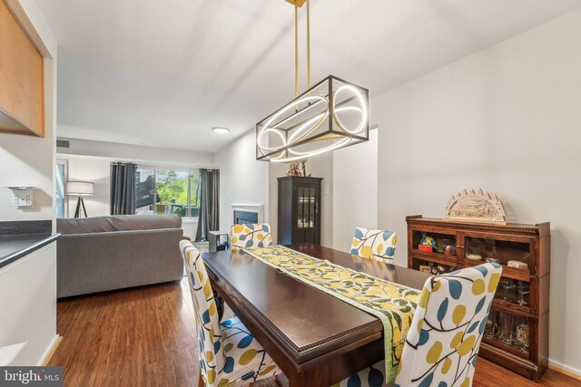 dining area featuring recessed lighting and dark wood-style floors