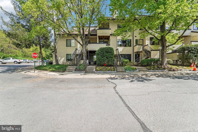 view of front of house with stairs