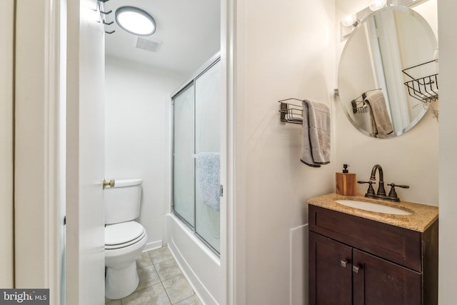 bathroom with vanity, bath / shower combo with glass door, toilet, and visible vents