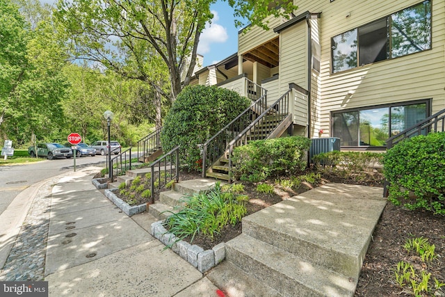 view of property's community featuring stairs