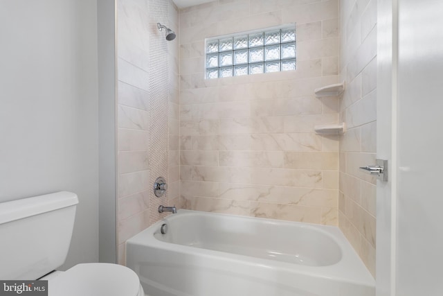 bathroom with bathtub / shower combination and toilet