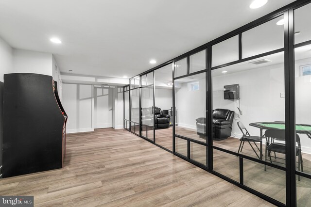 hall with visible vents, light wood-style flooring, recessed lighting, and baseboards