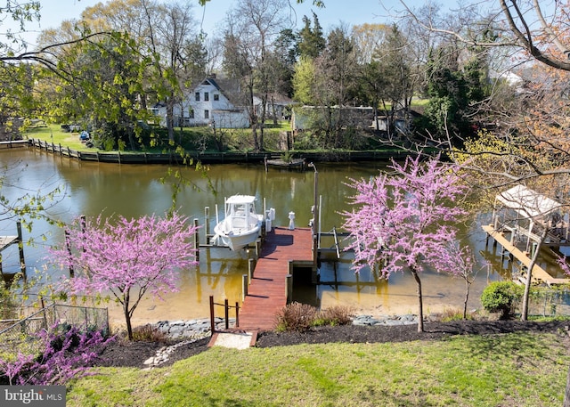 view of dock featuring a water view and boat lift