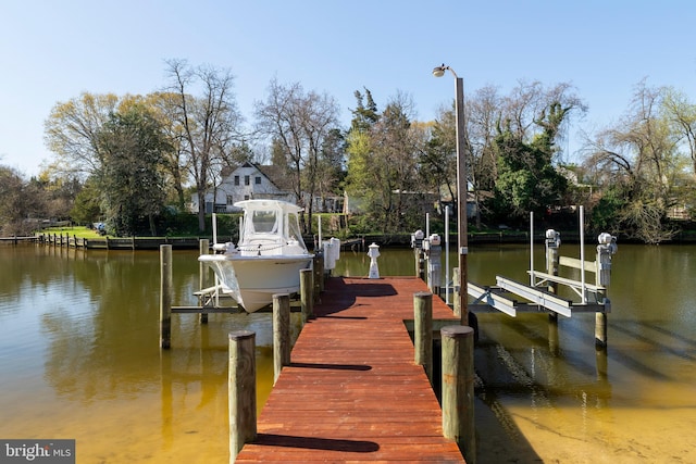 view of dock with a water view and boat lift