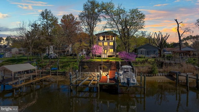 view of dock with a water view and boat lift
