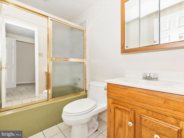 full bath featuring vanity, toilet, tile patterned flooring, and bath / shower combo with glass door