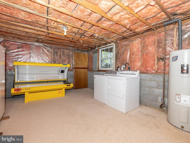 below grade area featuring separate washer and dryer, carpet, and electric water heater