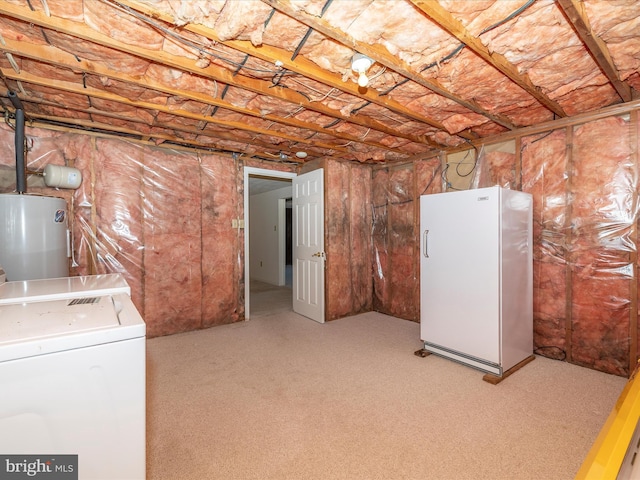 unfinished basement featuring carpet, washer and dryer, freestanding refrigerator, and electric water heater