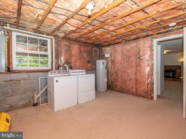 basement featuring separate washer and dryer, light carpet, and water heater