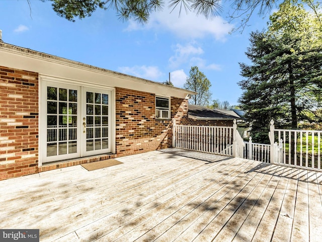 deck featuring french doors and cooling unit