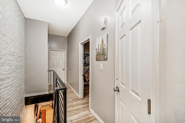 3963 Brown St, Philadelphia, PA 19104 - hallway featuring light wood finished floors, an upstairs landing, and baseboards
