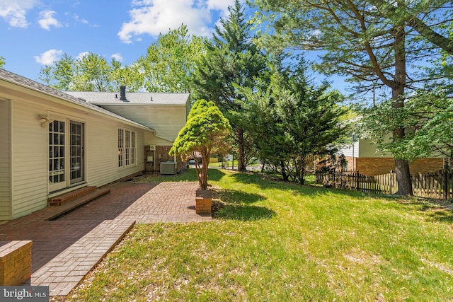 view of yard featuring fence and a patio area
