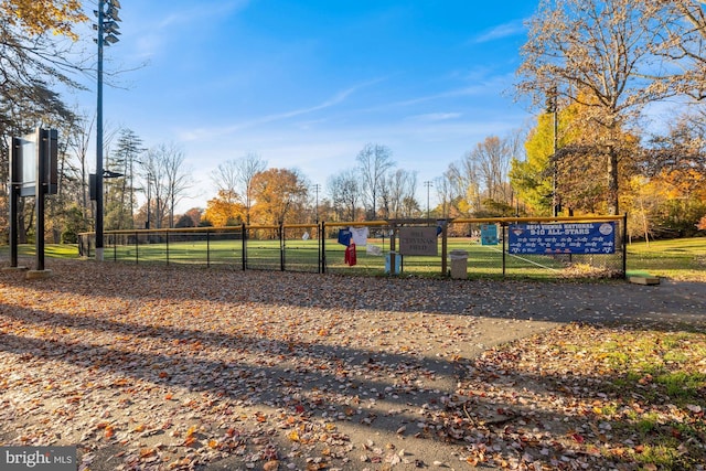 view of community featuring fence