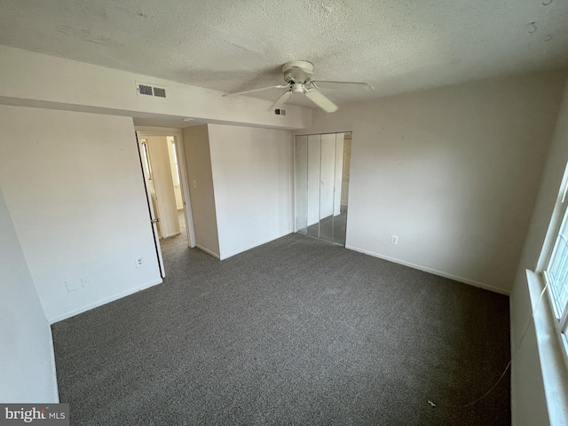 100 Park Blvd Unit 17D, Cherry Hill, NJ 08034 - unfurnished bedroom with a textured ceiling, baseboards, dark colored carpet, a closet, and ceiling fan