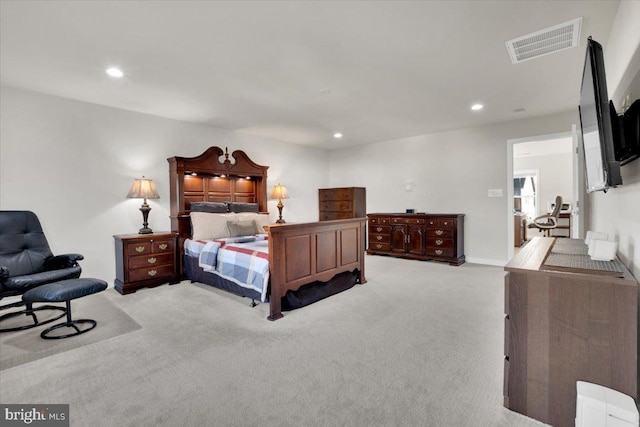 carpeted bedroom featuring recessed lighting and visible vents
