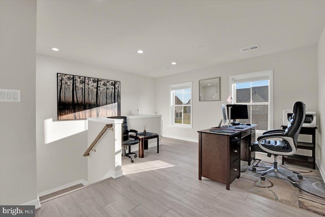 home office with visible vents, recessed lighting, light wood-style flooring, and baseboards