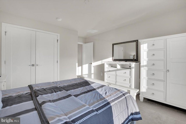 carpeted bedroom with a closet