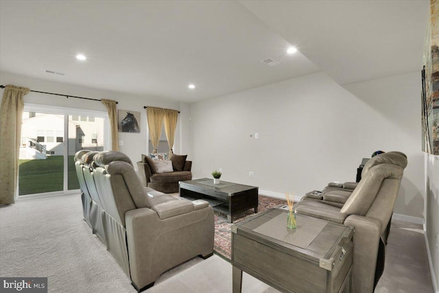 living room with recessed lighting, baseboards, visible vents, and light carpet