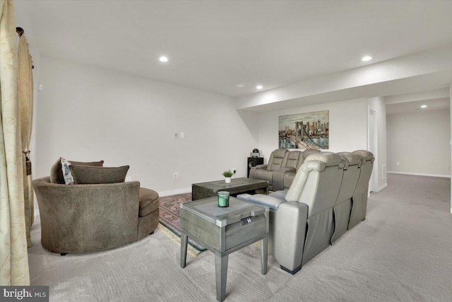 living room featuring recessed lighting, baseboards, and light colored carpet