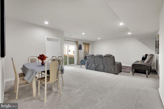 dining area with recessed lighting, baseboards, and light carpet