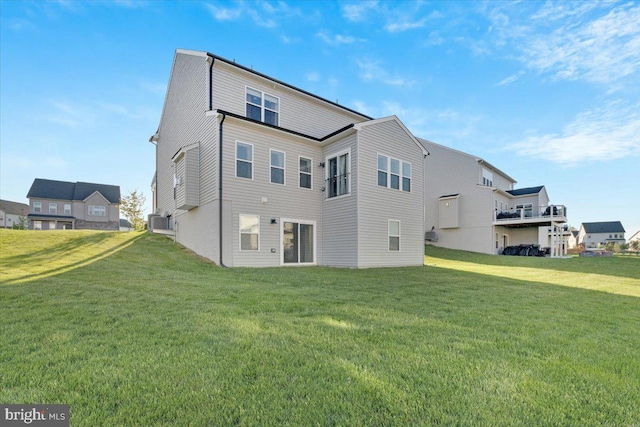 back of property with a yard