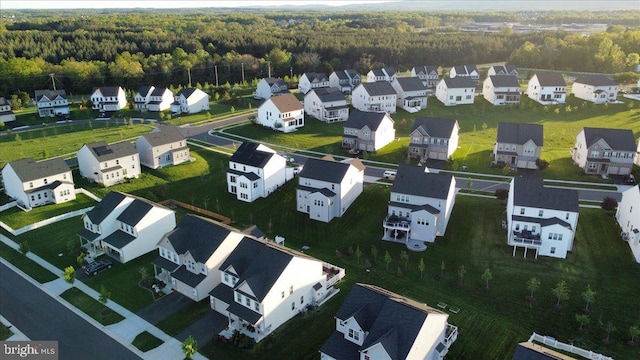 aerial view featuring a residential view and a view of trees