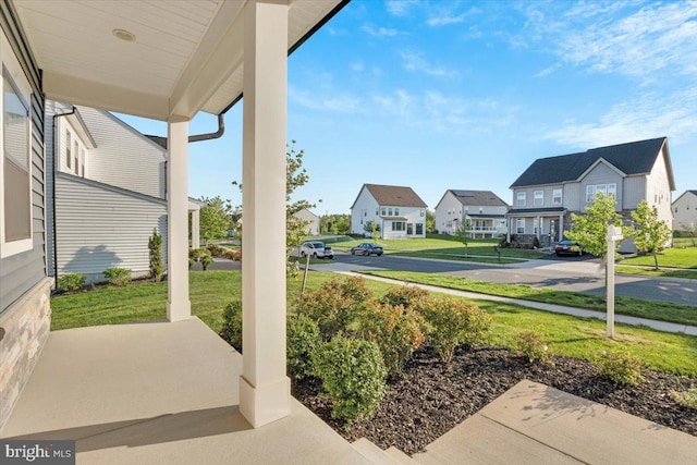 view of patio / terrace featuring a residential view and a porch