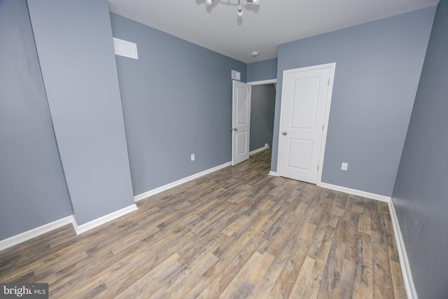 173 W Seymour St, Philadelphia, PA 19144 - unfurnished bedroom with wood finished floors and baseboards