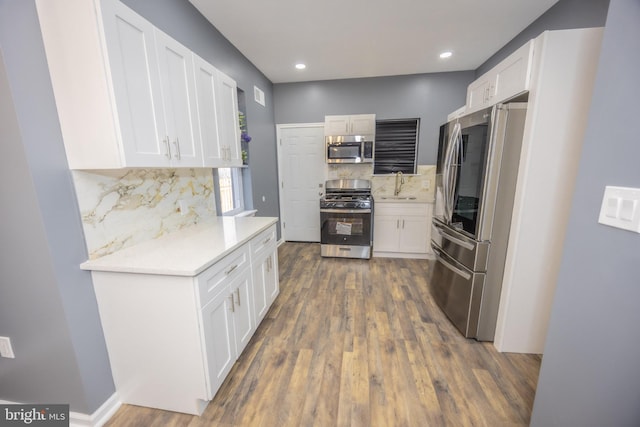 173 W Seymour St, Philadelphia, PA 19144 - kitchen featuring dark wood-style floors, light countertops, white cabinets, stainless steel appliances, and a sink