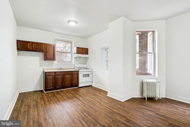 4914 N Smedley St, Philadelphia, PA 19141 - kitchen featuring white range with gas stovetop, dark wood-type flooring, a sink, and radiator