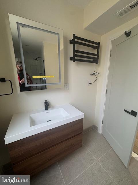 1809 Christian St, Philadelphia, PA 19146 - bathroom featuring vanity, baseboards, and visible vents