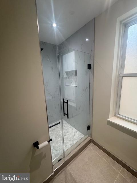 1809 Christian St, Philadelphia, PA 19146 - bathroom featuring a marble finish shower and tile patterned floors