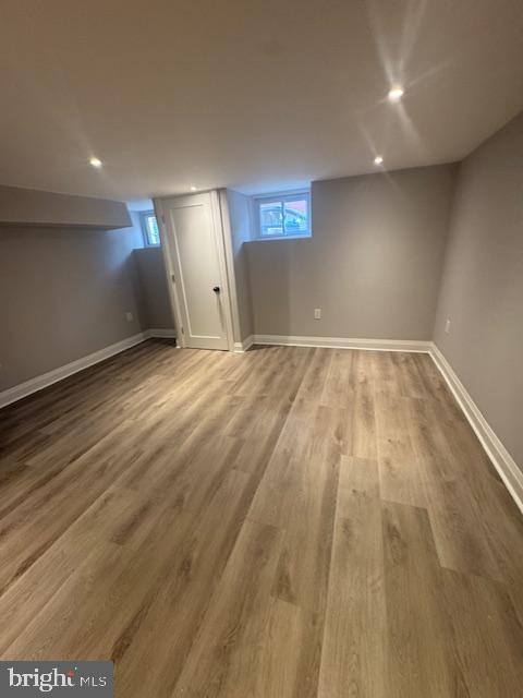 1809 Christian St, Philadelphia, PA 19146 - below grade area with baseboards, recessed lighting, wood finished floors, and a healthy amount of sunlight