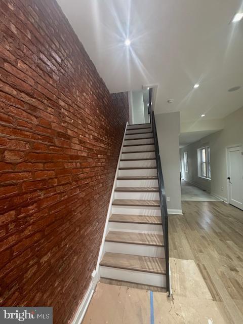 1809 Christian St, Philadelphia, PA 19146 - stairs with baseboards and wood finished floors
