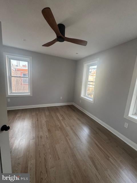 1809 Christian St, Philadelphia, PA 19146 - spare room with a ceiling fan, baseboards, and wood finished floors