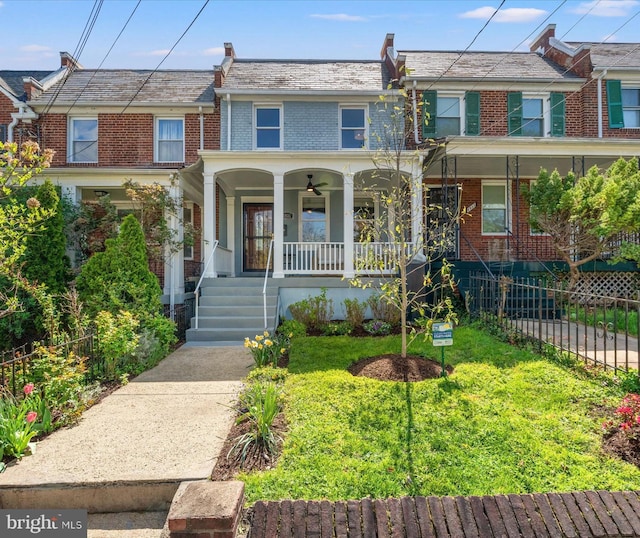 4935 New Hampshire Ave NW, Washington, DC 20011 - townhome / multi-family property with brick siding, fence, and covered porch