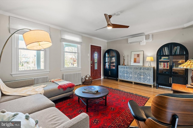 4935 New Hampshire Ave NW, Washington, DC 20011 - living room featuring a ceiling fan, crown molding, radiator, and wood finished floors
