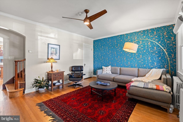 4935 New Hampshire Ave NW, Washington, DC 20011 - living area featuring crown molding, wallpapered walls, wood finished floors, and ceiling fan