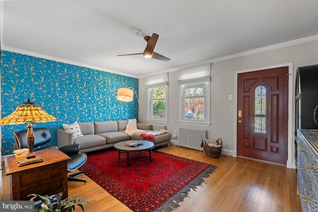 4935 New Hampshire Ave NW, Washington, DC 20011 - living area featuring radiator, a ceiling fan, ornamental molding, wood finished floors, and wallpapered walls