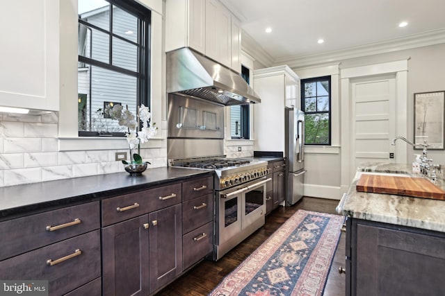 4777 33rd St N, Arlington, VA 22207 - kitchen with ornamental molding, extractor fan, white cabinetry, and appliances with stainless steel finishes