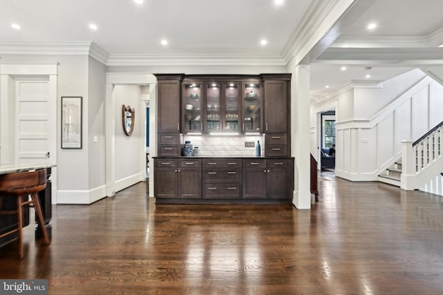 4777 33rd St N, Arlington, VA 22207 - bar with crown molding, stairs, backsplash, baseboards, and dark wood-type flooring