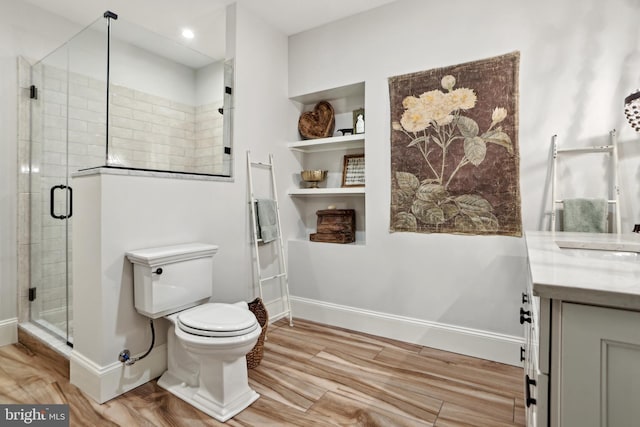 4777 33rd St N, Arlington, VA 22207 - full bathroom with toilet, baseboards, wood finished floors, and a stall shower