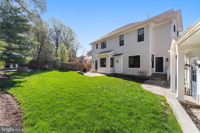 4777 33rd St N, Arlington, VA 22207 - back of house featuring fence, a patio area, a lawn, and entry steps