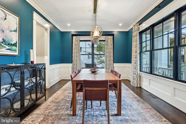 4777 33rd St N, Arlington, VA 22207 - dining room with wood finished floors, a decorative wall, crown molding, and a wainscoted wall