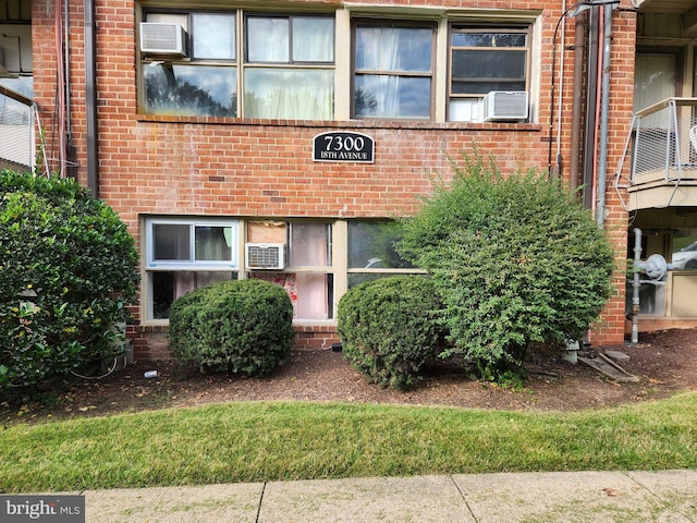 7300 18th Ave Unit 12, Hyattsville, MD 20783 - entrance to property featuring cooling unit and brick siding