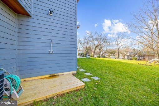 view of yard with a wooden deck