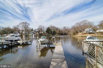 view of dock with a water view and boat lift