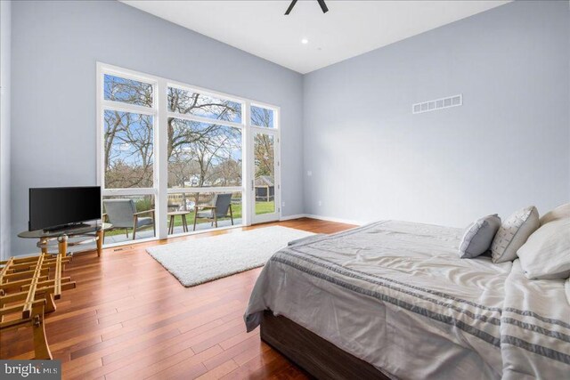 bedroom with visible vents, recessed lighting, baseboards, and wood finished floors