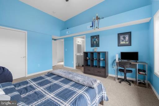 bedroom with baseboards and carpet